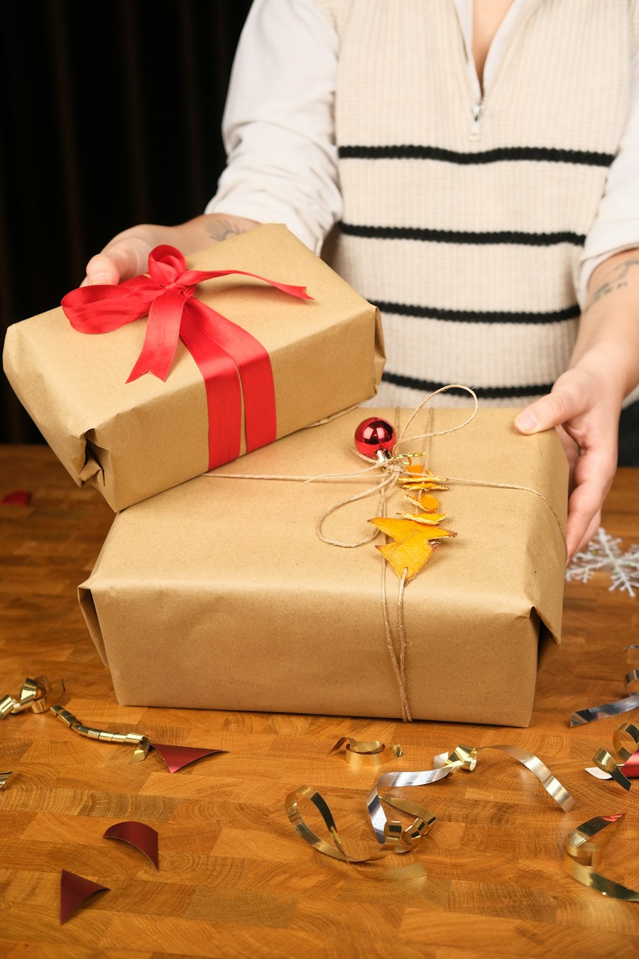 A ribbon being tied onto a card